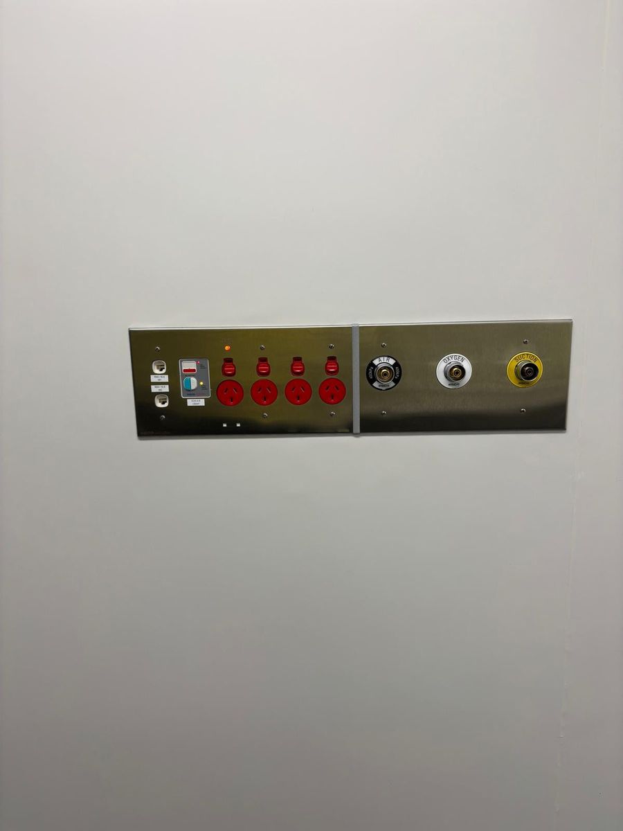 Medical air, oxygen and suction outlets on a medical service panel